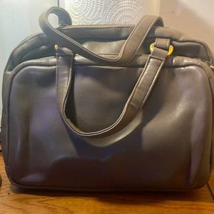 Light brown purse with gold  ascent’s looks vintage.